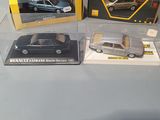 three different models of cars on display in a display case