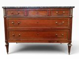 an antique chest of drawers with marble top