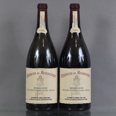 two bottles of wine sitting on top of a table next to each other