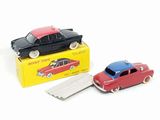 two toy cars that are sitting next to each other