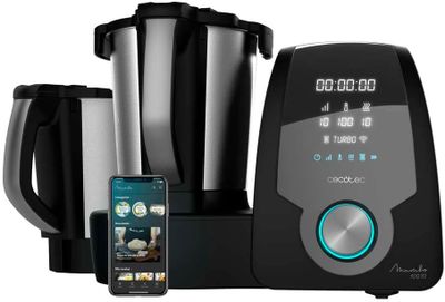 an image of a black and silver blender with a cell phone next to it