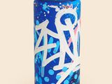 graffiti spray can on a white surface with a blue background