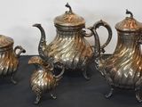 four piece silver plated tea set with matching teapots