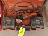 a red tool box that has some tools inside of it