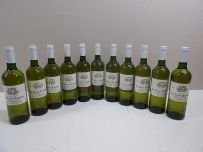 six bottles of white wine are lined up on a table