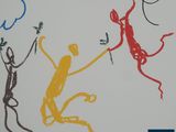 a picture of a drawing of a monkey and a monkey on a wall