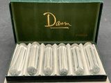 an image of a box with six empty glass tubes in it