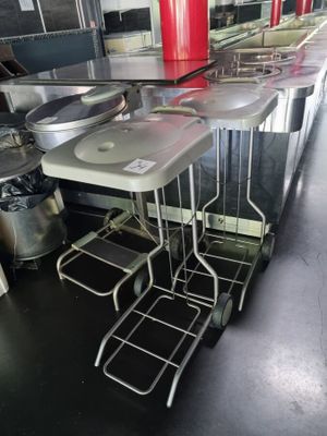a kitchen with a table and chairs in the middle of the room
