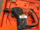an orange tool box with a drill in it