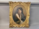 painting of a woman with long hair in a gold frame