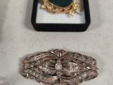 many different types of jewelry on a table