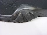 a close up of a black shoe with a black sole