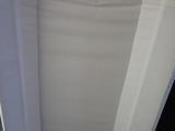 a white sheet of paper on a wooden table