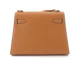 a brown leather handbag on a white background