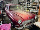 a red car that is parked in a garage