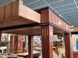 a room with a lot of wooden furniture in it