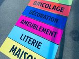 a sign that says jardin, bricolacee, decoration, ameliblement, litter, litter, and litter
