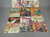 several comics are stacked on top of each other on a table