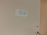 a sign on the door of a bathroom that says 1047