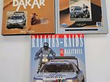 three books on a table with a car in the middle of them
