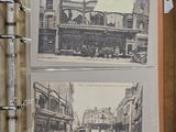 two old photos of a city in a book