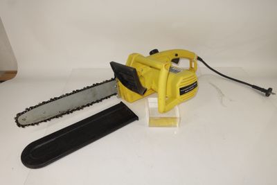 a yellow chainsaw sitting on top of a white table