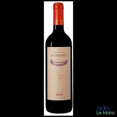 a bottle of red wine that is sitting on a table