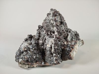 a close up of a piece of rock on a white surface