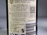 a label on a bottle of wine on a table