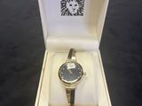 an image of a watch in a box on a table