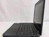 a black laptop computer sitting on a white surface