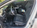 the interior of a car with the driver ' s seat folded down