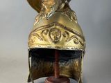 a close up of a helmet on a stand with a hat on it