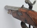 an old gun with a bird on the handle on a white background