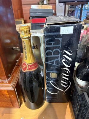 a bottle of wine and a box of wine on a table