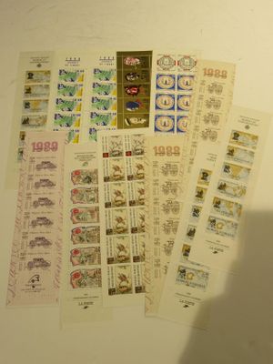 a lot of different stamps on the wall next to each other