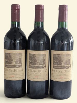 three bottles of wine sitting on top of a table next to each other