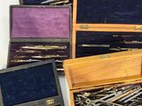a lot of different types of sewing needles in a box