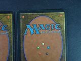 two decks of magic the gathering are shown on a table