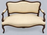 an image of a wooden and upholstered couch with beige upholstered upholstered