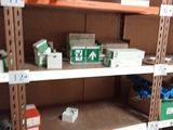 many shelves that have boxes on them in a store