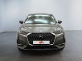 the front view of a grey dsx parked in a showroom