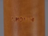 close up of a brown vase with the word mom written on it
