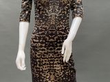 a mannequin wearing a brown and black dress with leopard print
