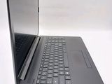 a laptop that is open on a white surface