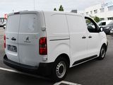 a white van that is parked in a parking lot