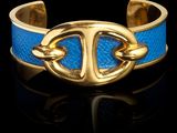 bracelet à boucle en cuir doré et bleu, muni d'une boucle dorée