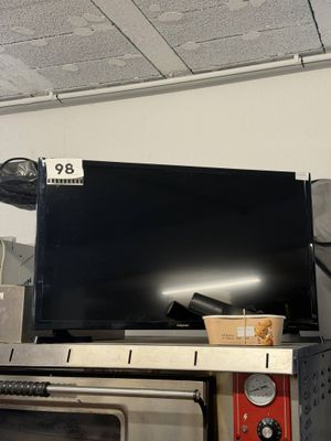 a television sitting on top of a table in a room