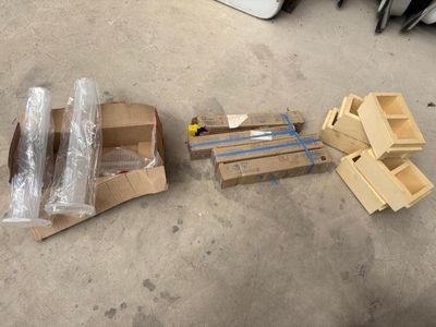 many boxes of cardboard and other items sitting on the floor