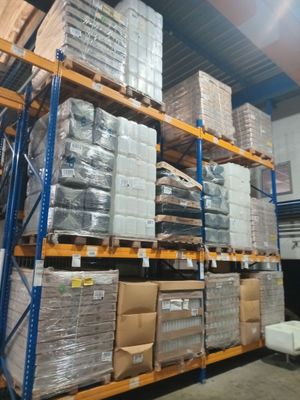 a lot of boxes on the shelves in the warehouse